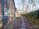 Landscaped backyard with stone pathway and wooden fence at 12 Woodvine Ln, Clover, SC 29710