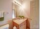 Light and airy bathroom with granite countertop and updated vanity at 12 Woodvine Ln, Clover, SC 29710