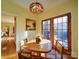 Bright breakfast nook features a charming wooden table and access to a private patio at 12 Woodvine Ln, Clover, SC 29710