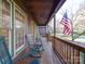 Relaxing front porch with rocking chairs and American flag at 12 Woodvine Ln, Clover, SC 29710