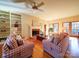 Living room with hardwood floors, fireplace, and built-in shelves at 12 Woodvine Ln, Clover, SC 29710