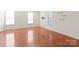 Spacious bedroom with hardwood floors and large windows at 1304 Queen Lyon Ct, Charlotte, NC 28205
