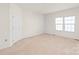 Empty bedroom with neutral walls and carpeting at 1304 Queen Lyon Ct, Charlotte, NC 28205
