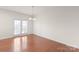 Dining room with hardwood floors and access to deck at 1304 Queen Lyon Ct, Charlotte, NC 28205