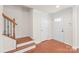 Bright entryway with hardwood floors and staircase at 1304 Queen Lyon Ct, Charlotte, NC 28205