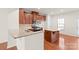 Modern kitchen with granite island and stainless steel appliances at 1304 Queen Lyon Ct, Charlotte, NC 28205