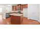 Modern kitchen with granite island and stainless steel appliances at 1304 Queen Lyon Ct, Charlotte, NC 28205