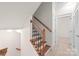 Wooden staircase with black metal railings leading to upper level at 1304 Queen Lyon Ct, Charlotte, NC 28205