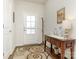 Bright entryway with coat rack, console table, and decorative rug at 1417 Turkey Roost Rd # 69, Fort Mill, SC 29715