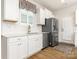 Modern kitchen with white cabinets, stainless steel appliances, and a sink at 1417 Turkey Roost Rd # 69, Fort Mill, SC 29715