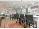 Open concept kitchen with island seating and views into the living room at 1417 Turkey Roost Rd # 69, Fort Mill, SC 29715
