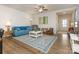 Bright living room featuring hardwood floors, comfy seating, and a large window at 1417 Turkey Roost Rd # 69, Fort Mill, SC 29715