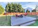 Spacious backyard deck with seating area and fire pit at 15210 Pangborn Pl, Charlotte, NC 28278