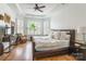 Bright bedroom with hardwood floors, a ceiling fan and a large window at 15927 Vale Ridge Dr, Charlotte, NC 28278