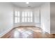 Bright bedroom with beautiful hardwood floors and natural light from shuttered windows at 15927 Vale Ridge Dr, Charlotte, NC 28278