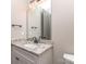 Bright bathroom features granite counters, modern vanity and fixtures at 18140 Kalabash Rd, Charlotte, NC 28278