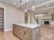 Modern kitchen island with granite countertops and stylish pendant lighting at 18140 Kalabash Rd, Charlotte, NC 28278