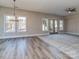 Spacious living room with hardwood floors and carpet, with a large window and natural light at 18140 Kalabash Rd, Charlotte, NC 28278