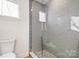 Bathroom with a large walk-in shower and gray tile at 2005 Atherton Heights Ln, Charlotte, NC 28203