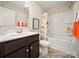 Clean bathroom with dark vanity and shower/tub combo at 205 Cliffwood Nw St # B-2, Concord, NC 28027
