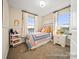 Cozy bedroom with colorful decor and ample natural light at 205 Cliffwood Nw St # B-2, Concord, NC 28027