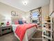 Bright bedroom with coral comforter and gray nightstand at 205 Cliffwood Nw St # B-2, Concord, NC 28027