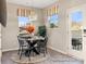 Bright dining area with a round table and chairs, providing a comfortable eating space at 205 Cliffwood Nw St # B-2, Concord, NC 28027