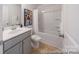 Bright bathroom featuring shower-over-tub with modern fixtures and neutral decor at 205 Cliffwood Nw St # B-2, Concord, NC 28027