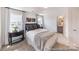 Comfortable bedroom with a cozy bed, neutral decor, and a view of the bathroom at 205 Cliffwood Nw St # B-2, Concord, NC 28027