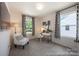 Cozy bedroom with a large window, ideal for use as a guest bedroom or a home office at 205 Cliffwood Nw St # B-2, Concord, NC 28027