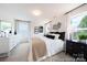 Comfortable bedroom boasts windows, stylish decor, and neutral colors at 205 Cliffwood Nw St # B-2, Concord, NC 28027