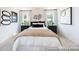 Inviting bedroom with plush bedding, stylish decor, and abundant natural light at 205 Cliffwood Nw St # B-2, Concord, NC 28027