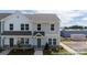 Lovely townhome exterior featuring stone accents and a well-maintained landscape at 205 Cliffwood Nw St # B-2, Concord, NC 28027