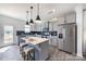 Modern kitchen featuring stainless steel appliances and a stylish center island at 205 Cliffwood Nw St # B-2, Concord, NC 28027