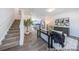 Inviting living room with stairs, an open floor plan, and modern decor offers a welcoming space at 205 Cliffwood Nw St # B-2, Concord, NC 28027