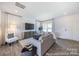 Inviting living room featuring a comfortable sofa, stylish decor, and plenty of natural light at 205 Cliffwood Nw St # B-2, Concord, NC 28027