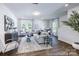 Spacious living room features hardwood floors, stylish furniture, and ample natural light for comfortable living at 205 Cliffwood Nw St # B-2, Concord, NC 28027