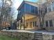 Multi-level patio with screened porch and stairs leading to the backyard at 2321 Herrons Nest Nw Pl, Concord, NC 28027