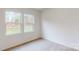 Bright bedroom with neutral carpeting and large windows at 254 Winford Rd, Troutman, NC 28116