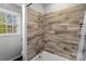 Bathroom features a tub/shower combo and wood-look tile at 261 Skyline Rd, Hickory, NC 28601