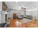 Living room with hardwood floors, stone fireplace, and sectional sofa at 261 Skyline Rd, Hickory, NC 28601