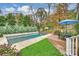 Inviting backyard pool with patio and landscaping at 342 Wendover Hill Ct, Charlotte, NC 28211