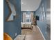 Spacious bedroom with blue walls and ample natural light at 3630 N Davidson St # 2210, Charlotte, NC 28205