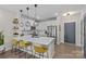 Modern kitchen with white cabinets, quartz countertops, and pendant lighting at 3630 N Davidson St # 2210, Charlotte, NC 28205