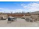 Outdoor patio with seating, fire pit, and tables at 3630 N Davidson St # 2210, Charlotte, NC 28205