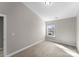 Well-lit bedroom with a window overlooking the neighborhood at 3698 Aldeburgh Sw Rd, Concord, NC 28027