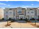 Three-unit townhome building with neutral siding and landscaping at 3698 Aldeburgh Sw Rd, Concord, NC 28027