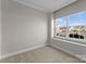 Spacious living room featuring a large window and neutral wall colors at 3698 Aldeburgh Sw Rd, Concord, NC 28027