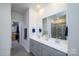 Modern bathroom boasts double vanity, walk-in shower, and large mirror at 6420 Barcelona Way, Charlotte, NC 28214