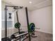 Home gym with weight bench, barbell, and weightlifting machine at 6420 Barcelona Way, Charlotte, NC 28214